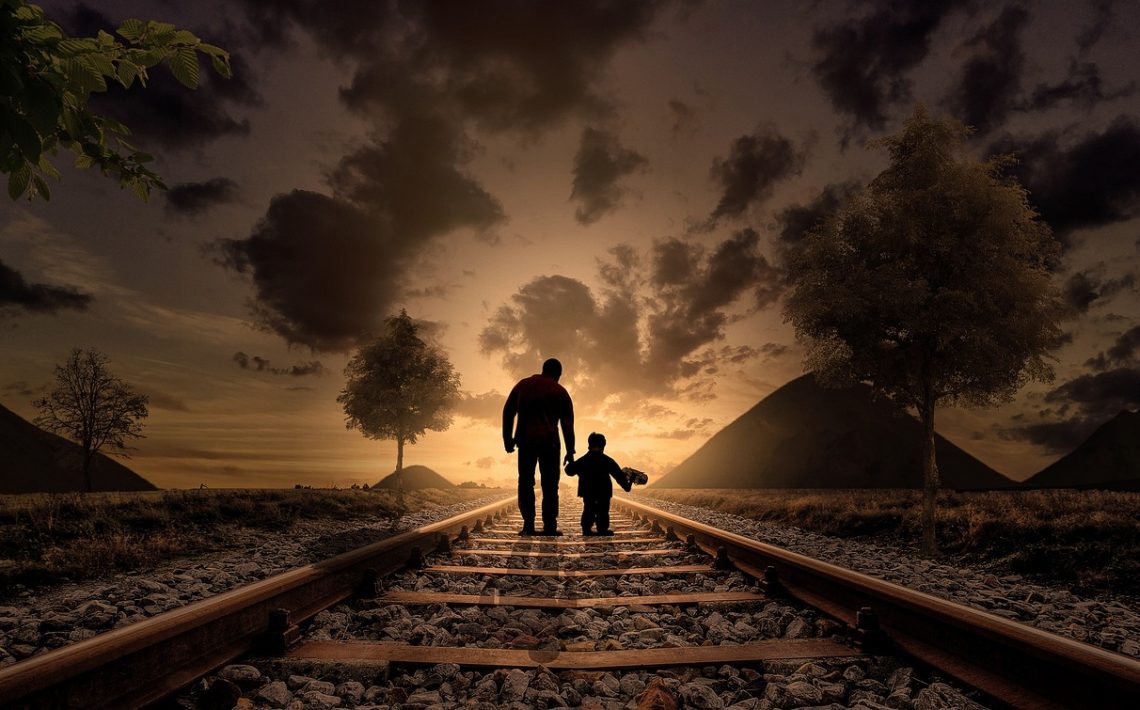 father and son, walking, railway